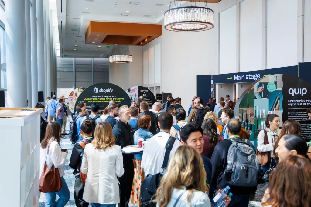 Photo of ChargeX 2025 attendees between sessions